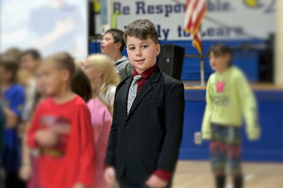 Logan Delmore wore his best for the Veterans Day ceremony at Lincoln School.  His father, Brennon, served 4 years in the Marines.