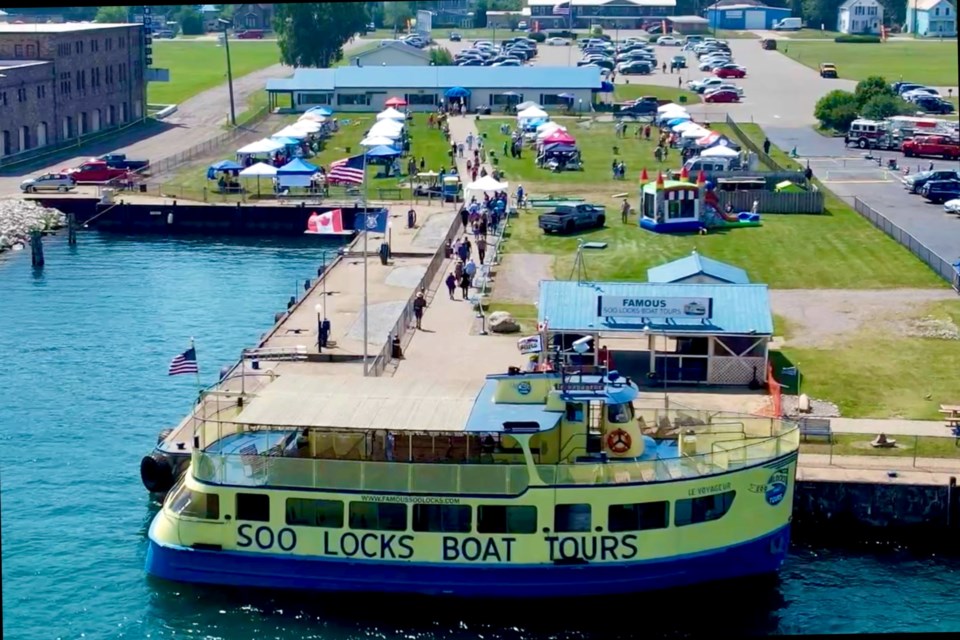 Sunshine and slight breezes Saturday welcomed those who attended the SideLock Sales event at Famous Soo Locks Boat Tours.