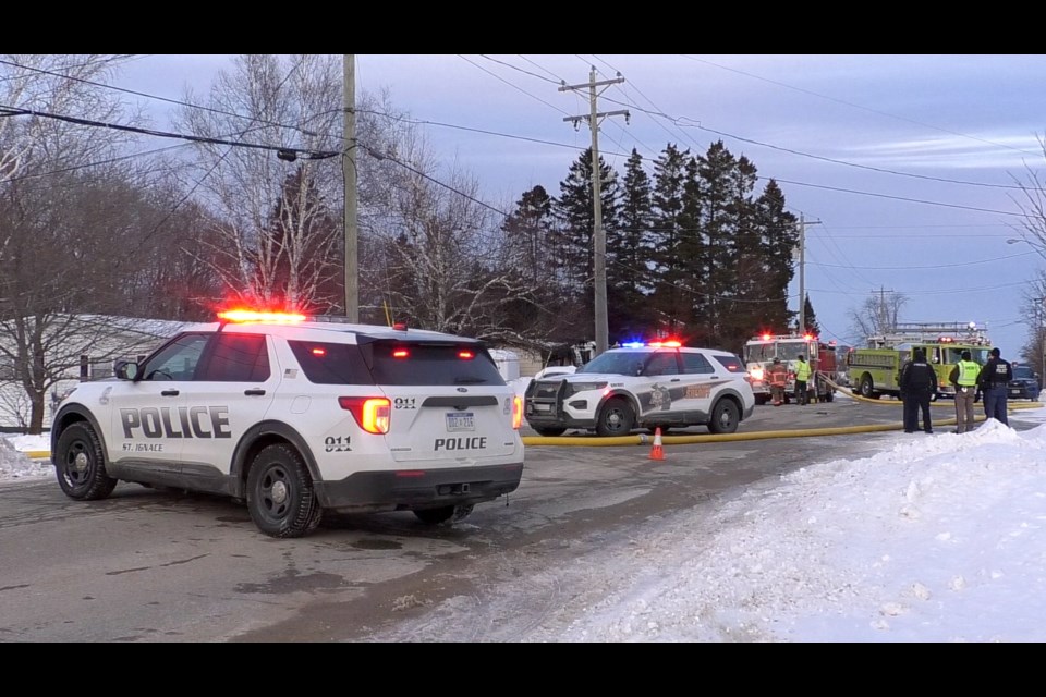 Multiple law enforcement agencies and fire departments were at the scene on Portage St. across from the St. Ignace school property.