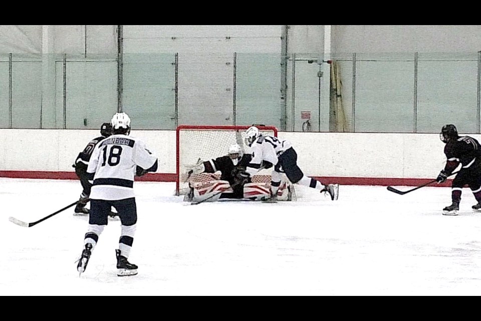 Garrett Gorsuch slices the puck past Knights goalie Grant Mathewson for the only score of the game.