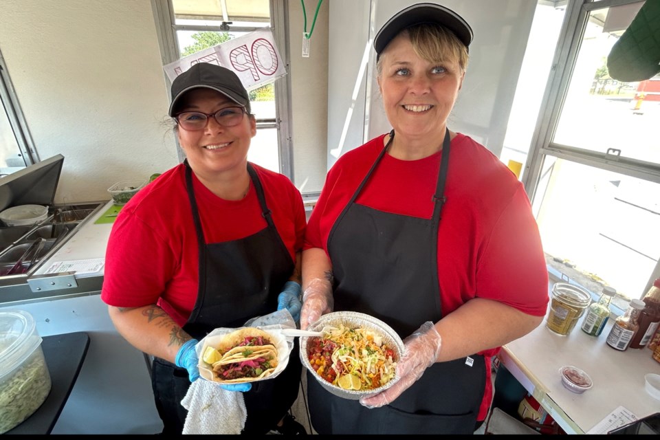 The street tacos and taco bowls are the two favorites of customers.
EmmaLee Jenson holds the freshly made street tacos and Beckie Johnson holds the taco bowl.