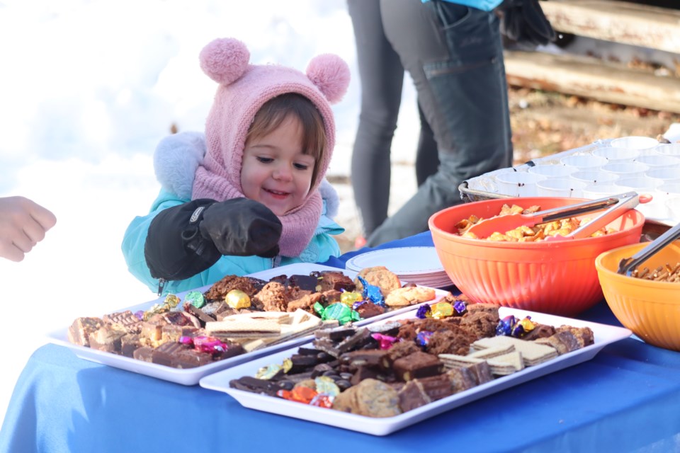 Skiers and snowshoers of all ages enjoyed some chocolate and other treats while exploring the trails at Stokely Creek Lodge in support of ARCH on Feb. 4, 2024. 