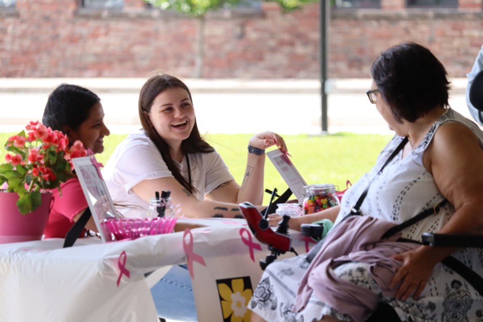 Volunteers with the CIBC Run for the Cure were at the Jamestown Strong West End Vendor Show on Sunday; annual 5-km run supporting breast cancer research takes place at the Roberta Bondar Pavilion on Oct. 6, 2024.