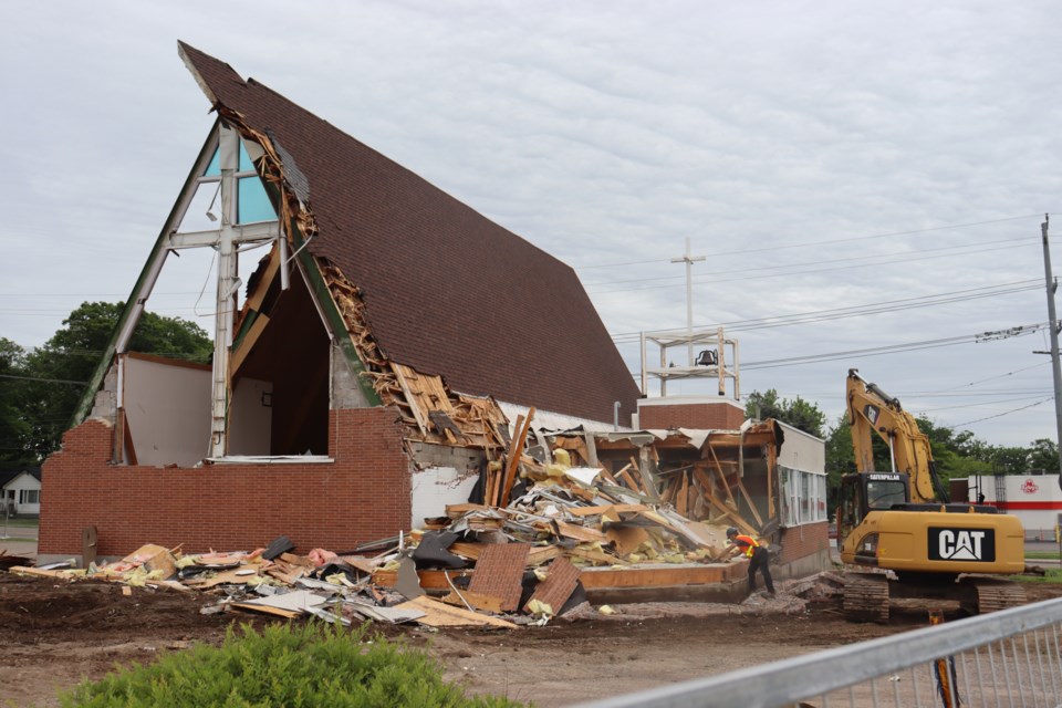 Portions of Holy Trinity Church are disappearing as demolition crews have begun taking down the 63-year-old Northern Avenue place of worship.