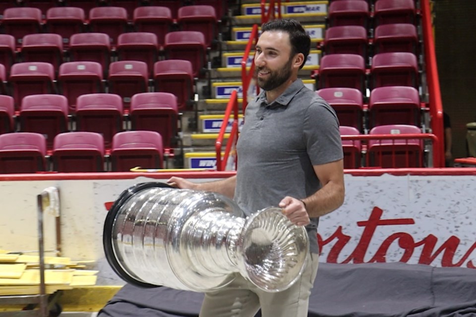 Michael Amadio enters the GFL Memorial Gardens with the coveted Stanley Cup on July 19, 2023