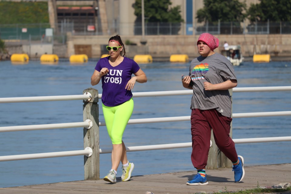 Walkers, runners, and cyclists enjoyed a beautiful day along the boardwalk during Pride Stride & Ride on July 22, 2023