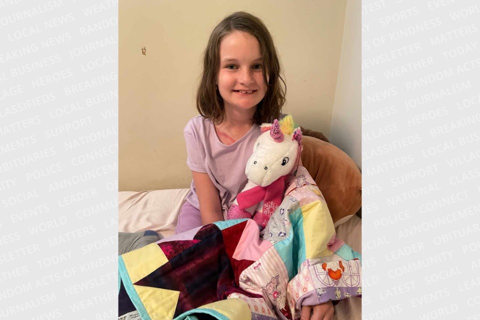 Eleven-year-old Khloe required some medical attention following a Saturday afternoon collision she was involved in at Trunk Road and Dacey Road; she's pictured with a stuffie and handmade blanket given by emergency crews who helped relieve her nerves at the scene.