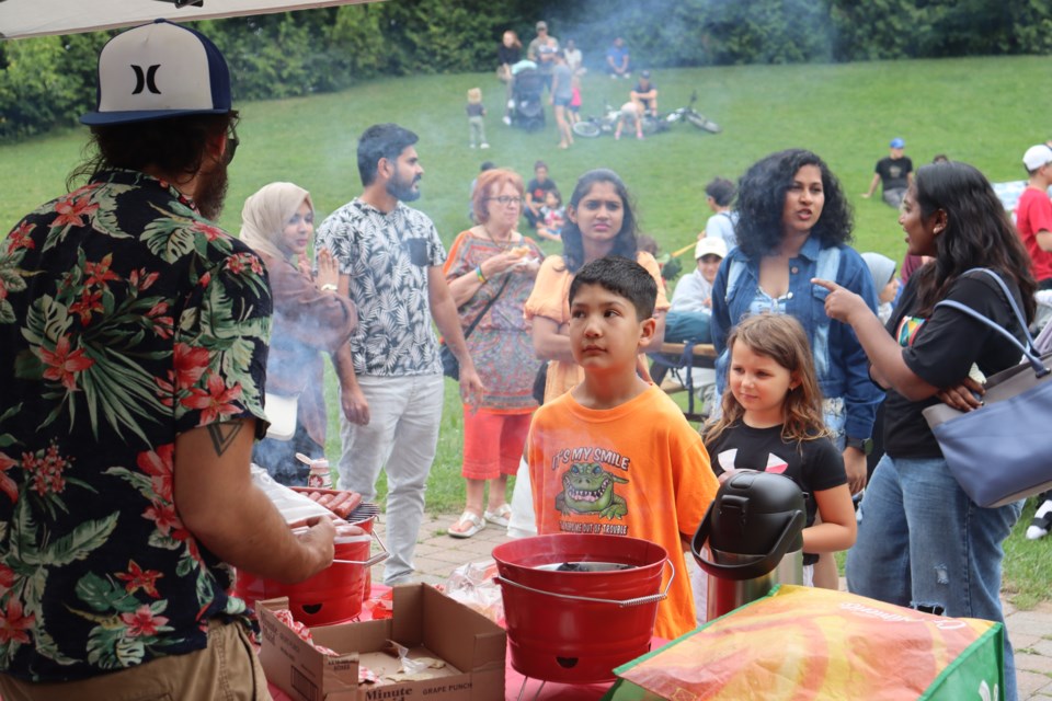 Dozens enjoyed music and free authentic Syrian food at Bellevue Park's bandshell on Sunday.