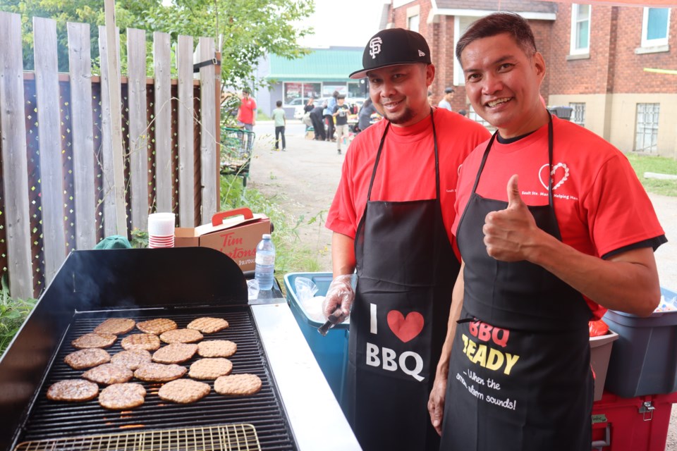 Barbecue, yard sale, and balloon animals were among the highlights during another successful Helping Hands fundraiser on Saturday.