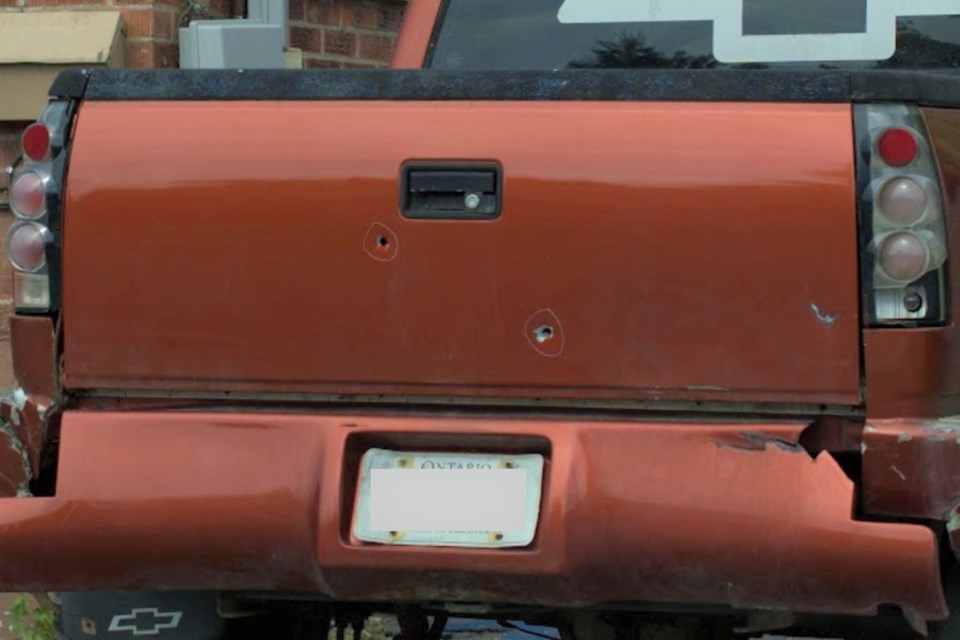 A house and a pickup truck in the 400 block of Douglas Street are pictured with damages from several bullets that were fired in the early morning hours Sept. 16