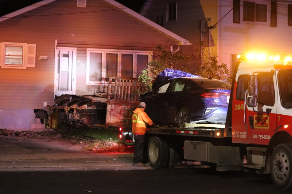 A house on the corner of Wellington Street West and Henrietta Avenue is left with severe damages after a car drove into the structure's front end on Sept. 20, 2022.