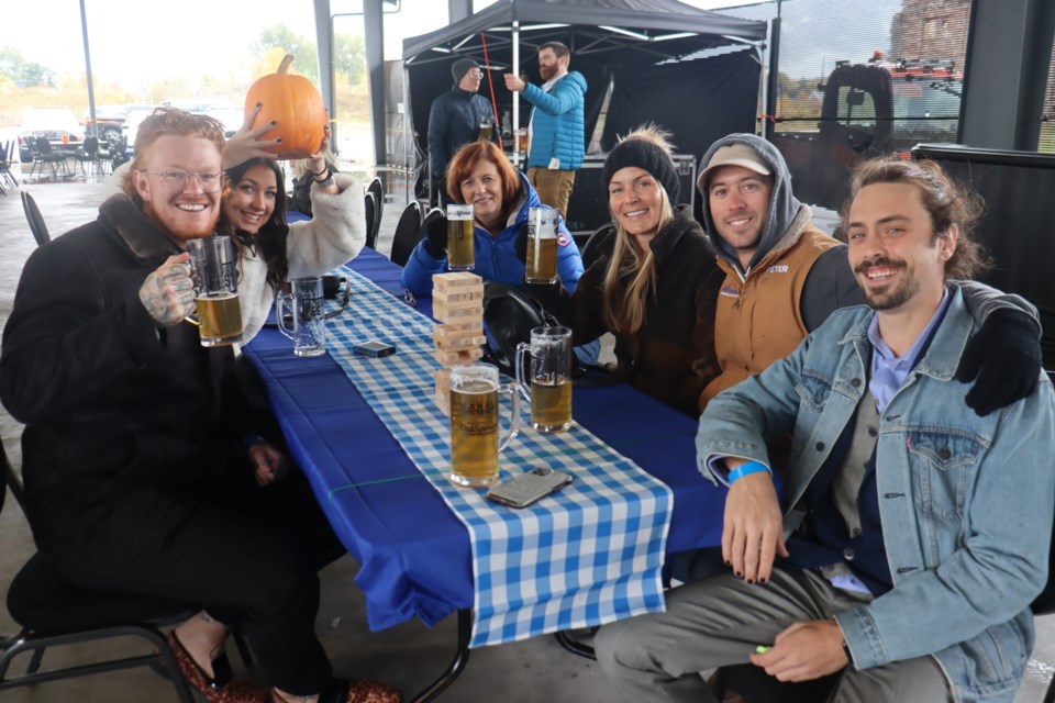 Despite the rain, locals are staying dry at The Rink as this year's Oktoberfest is providing savoury beer, live entertainment, and fun activities. 