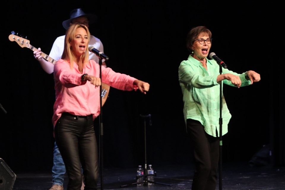 Sharon Hampson (right) from Canada's popular children's musical group Sharon, Lois & Bram performed classic hits like 'Skinnamarink' with her daughter Randi (left) at Korah Collegiate on Saturday. 