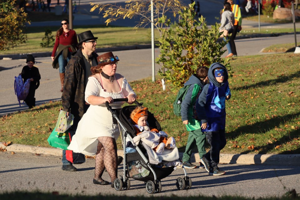 Hundreds of local trick-or-treaters collected candy from one end of Algoma University's campus to the other on Friday.