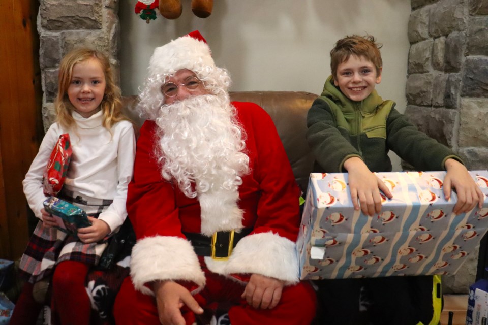 Santa Claus took time out of his busy schedule to visit with local kids at Helping Hands on Dec. 9, 2023.