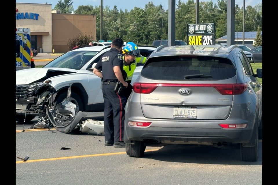 Emergency crews respond to a crash near the Second Line entrance to the Michael’s and Walmart stores on Saturday, July 13