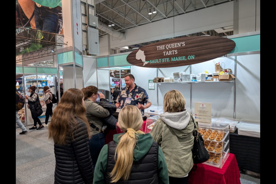 Aaron Craig of The Queen’s Tarts serving up signature tarts to eager guests of the Northern Ontario Agri-Food Pavilion at the 2024 Royal Agricultural Winter Fair in Toronto