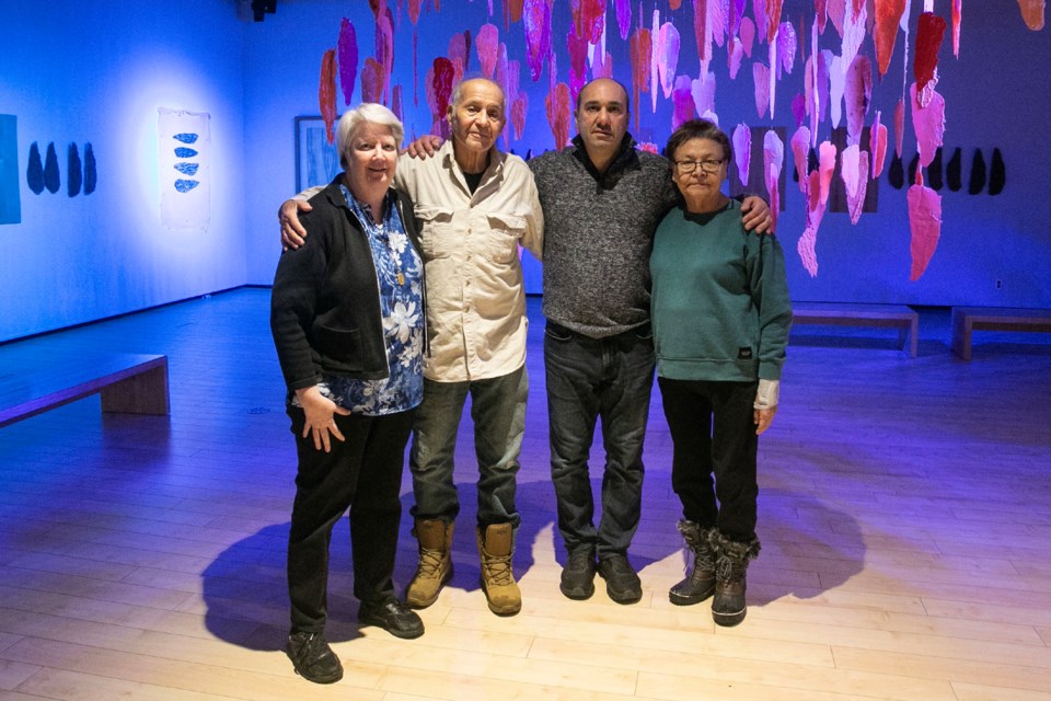 Sister Mary Jo Radey, Noel “Skip” Jones, Adriano DiCerbo and Barbara Nolan pose for a photo in the main gallery space at the Art Gallery of Algoma, which is currently showing the group's Confluence exhibit