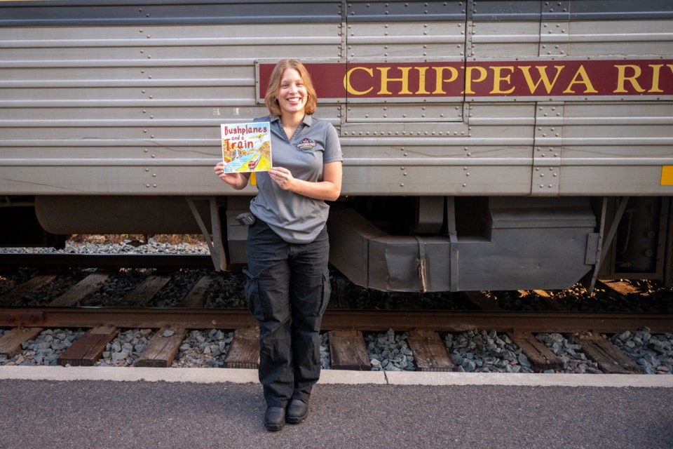 'Bushplanes and a Train,' by Richard Jones and illustrated by Amy Williams, is a sequel to 'Bailey the Bushplane.' Jessica Bannister, of the Agawa Canyon Tour Train giftshop, holds a copy.