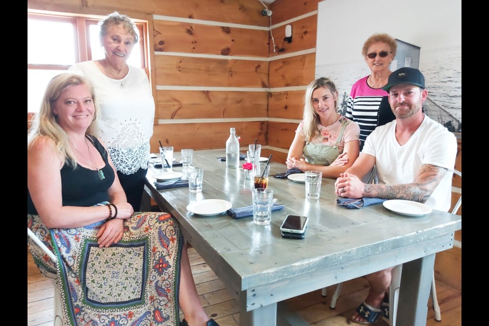 Geraldine Sarff and Carole Cartier, daughters of original owners of McCauley’s Motel, with Leanne Martineau, Havilland Shores Kitchen and Bar co-owner and Alicia and Justin Doucette, new McCauley’s Motel owners, July 23, 2022.