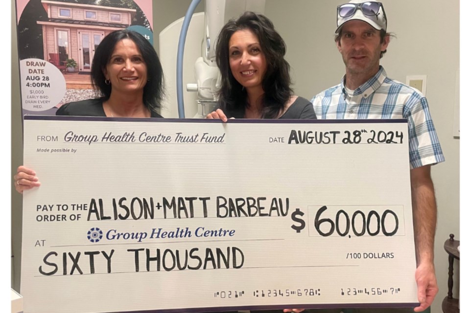 Group Health Centre president and CEO Lil Silvano with Alison and  Matt Barbeau, winners of the inaugural Breast Health Bunkie Lottery