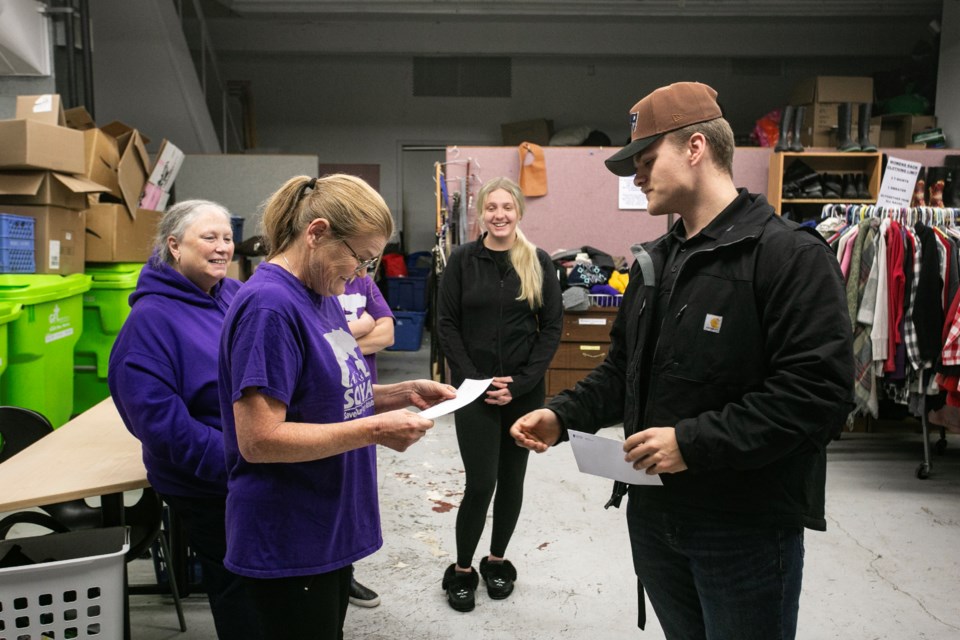 Aaron Wheten presents a cheque for $5,500 to SOYA founder Connie Raynor-Elliott at the SOYA depot on Tuesday. The funds were raised through the Matt Wheten Legacy Tournament that was started four years ago after Aaron's brother Matt was killed in a motor vehicle collision