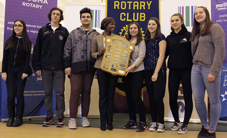 Students from St. Mary's College accept the Alfred R. Askin Shield for best Intermediate school team participation and excellence from Rotary president Melinda Mills. Photo by Dan Pernokis.