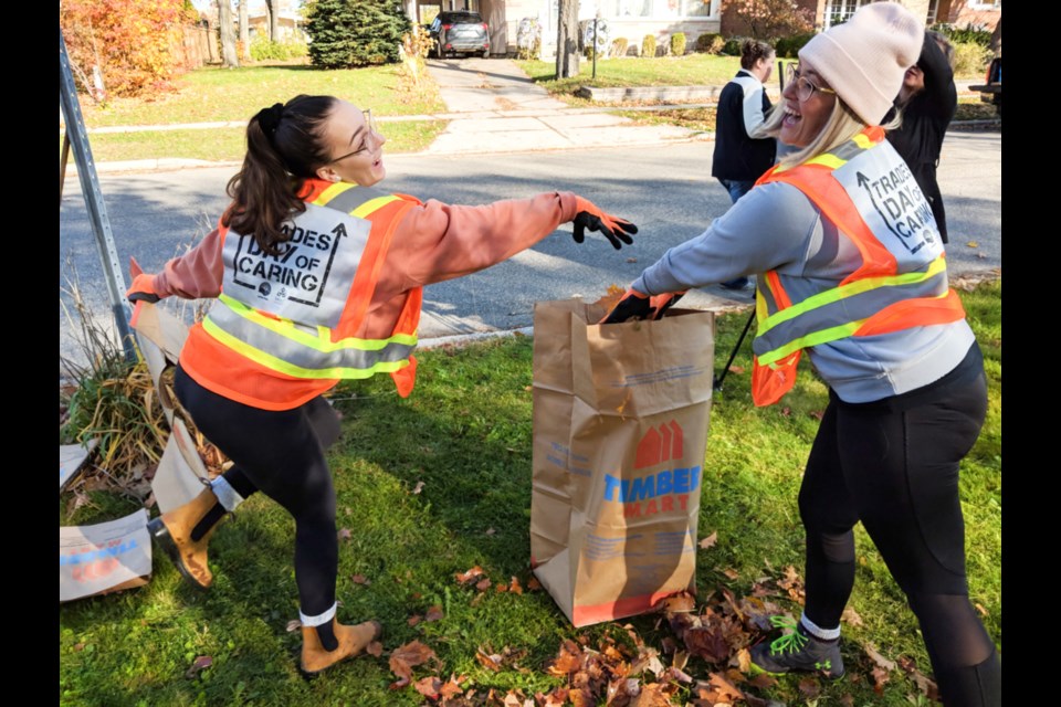 Two Sault College trades students share a laugh while raking leaves during the annual United Way Sault Ste. Marie and Algoma District Trades Day of Caring, Oct. 26, 2019. Darren Taylor/SooToday  