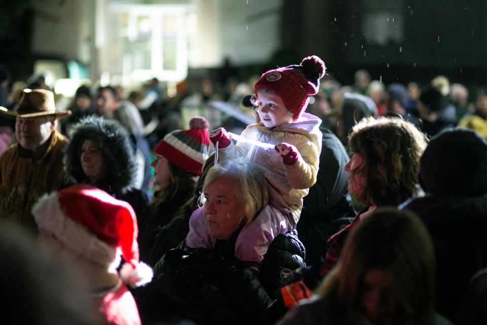 The last drops of rain fall about 10 minutes before Santa Claus arrived for the Community Tree Lighting and Moonlight Magic on Thursday evening at the Sault Ste. Marie Court House.