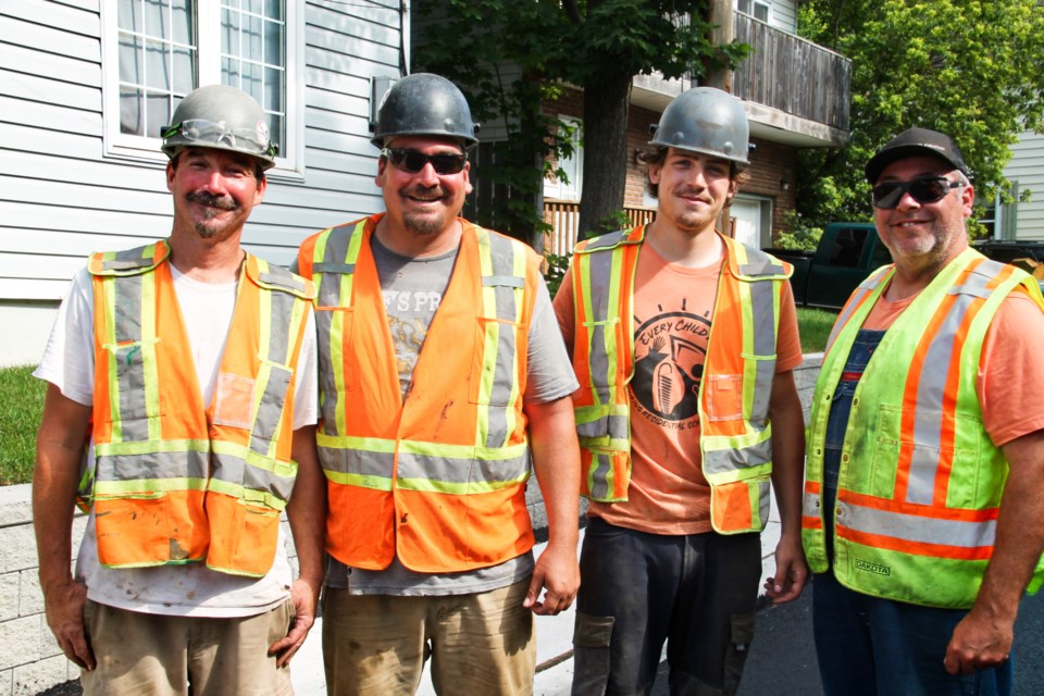 Contractors Reg ‘Moose’ Tegosh, Chris ‘Bunz’ Tegosh, Preston Buchholtz and Eldon Warren are all smiles as Biggings Avenue reconstruction has come to an end, July 8, 2024.