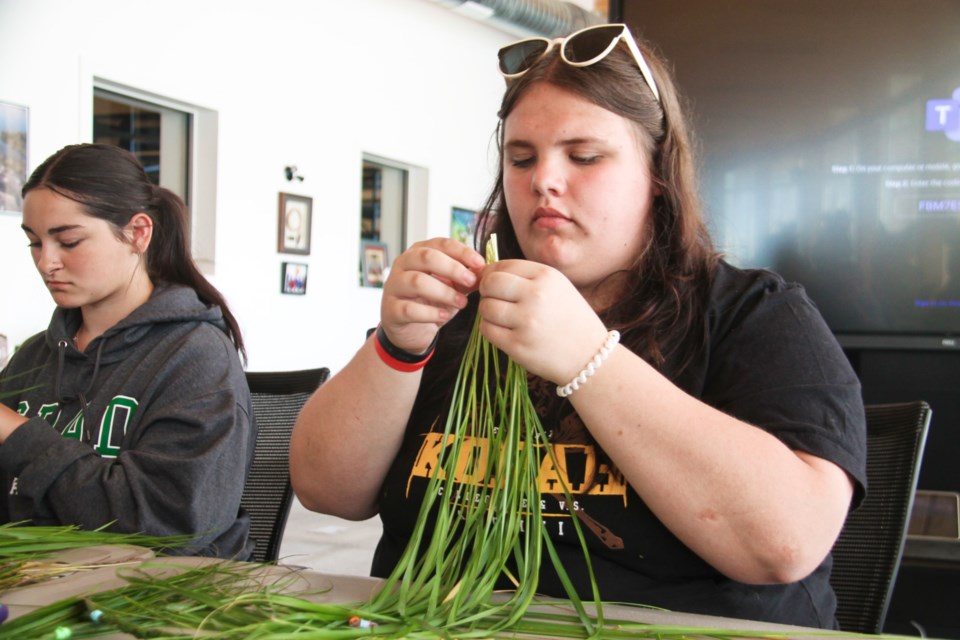 Ella May Kidder is one of five Indigenous ADSB high school students mentoring Indigenous Grade 8 graduates preparing for their own leap to Grade 9 this fall, joining them in conversation and hands-on activities at the school board’s annual Indigenous Summer Transition Camp at SKG, July 12, 2024.