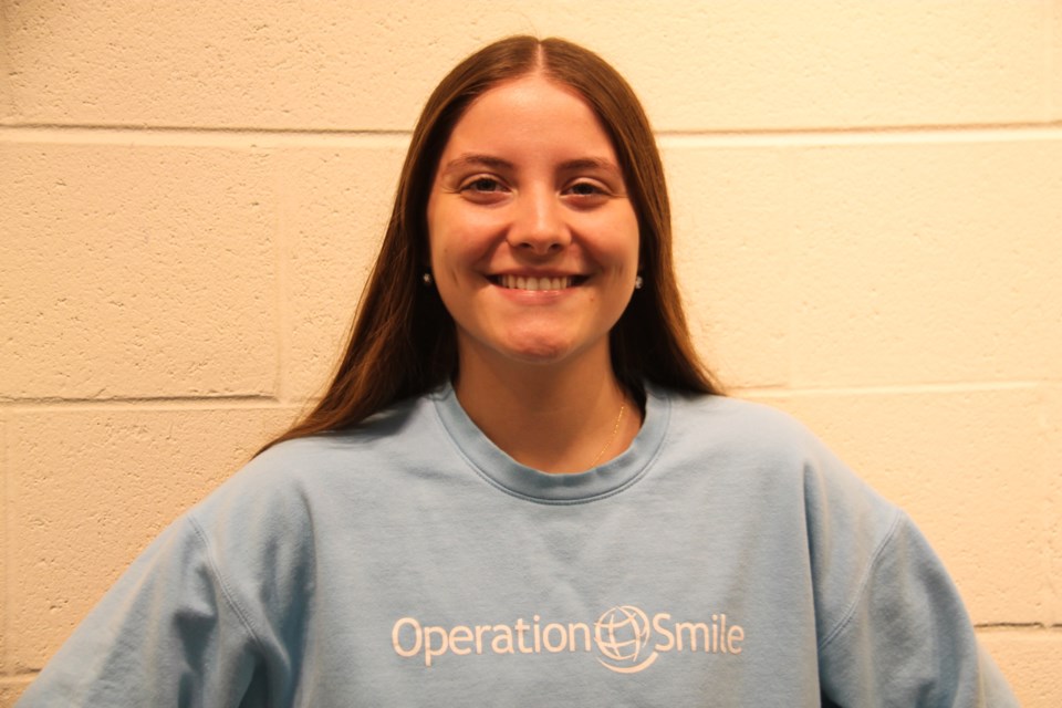 High school student Danielle Baril, committed to helping children through Operation Smile and planning a career in social work, pictured at St. Mary’s College, Sept. 3, 2024.