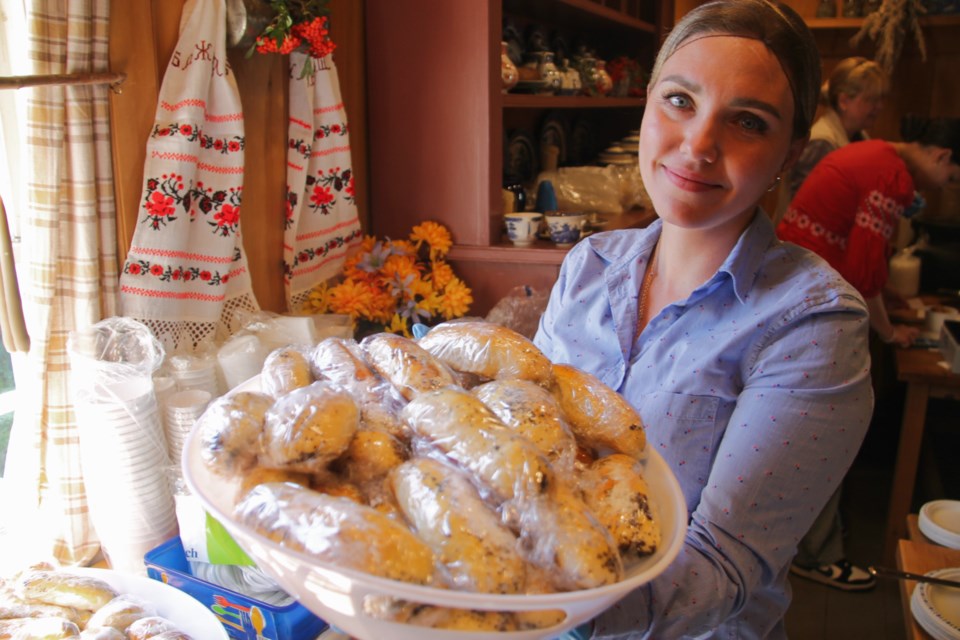 Alona Riznyk with a makoviy loaf at a Ukrainian-Canadian Heritage Day celebration at the Ermatinger Clergue National Historic Site, Sept. 7, 2024.