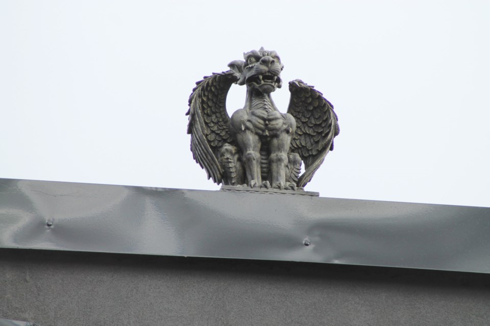 Gargoyles sit atop the building that houses Cafe 4 Good