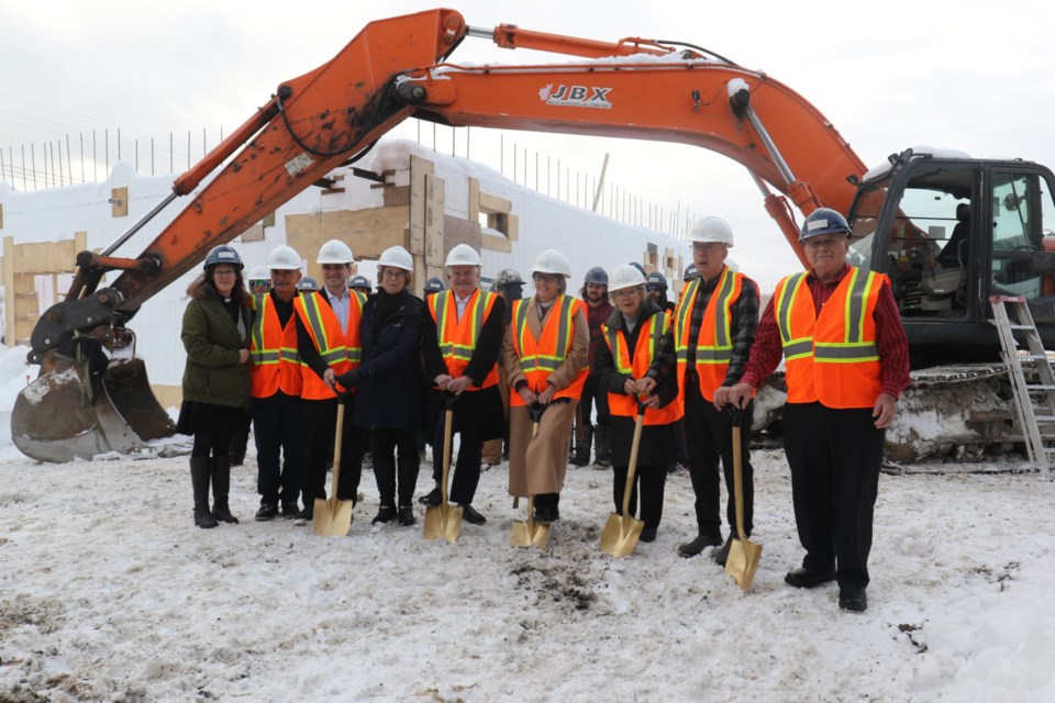 Sault Ste. Marie MP Terry Sheehan, middle, joined Sault Mayor Matthew Shoemaker and a number of project stakeholders for a photo opportunity at the forthcoming Trinity Tower on Northern Avenue Friday. 