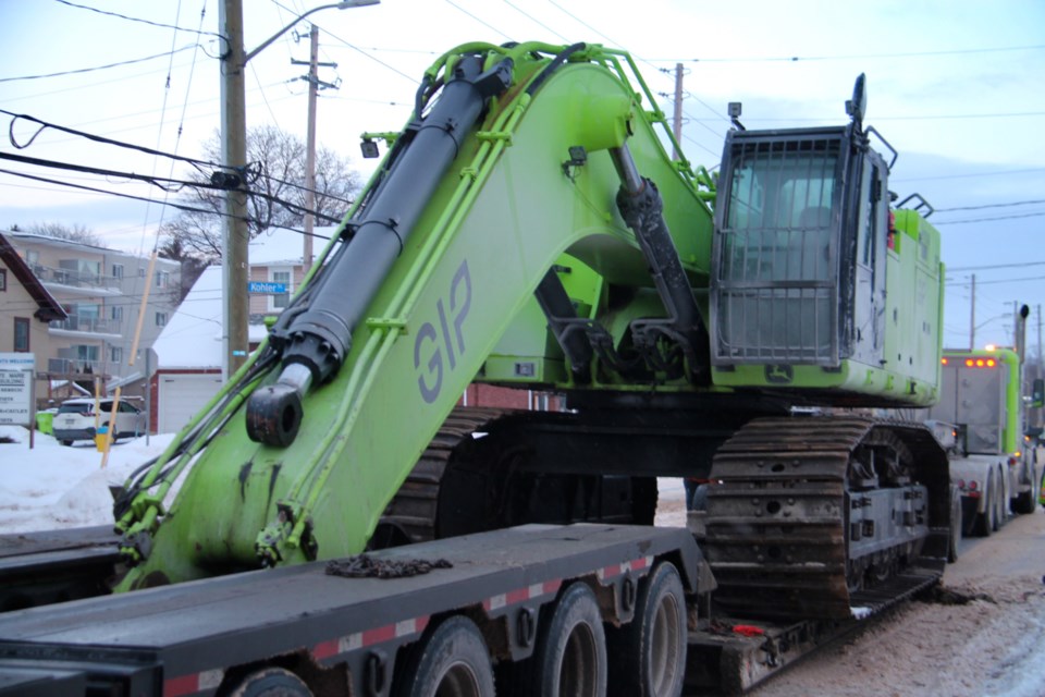 A large excavator owned by Green Infrastructure Partners Inc. (GIP) was moved on to the old General Hospital site on Queen Street East in preparation for the building’s demolition, Jan. 23, 2025.