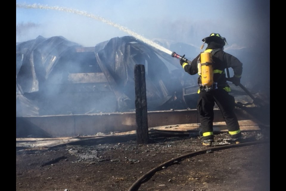 Three fire crews from Bruce Mines, Johnson Township and Tarbutt Township responded to a fire just west of Bruce Mines Saturday. A house and workshop, reportedly belonging to a Mennonite family, were destroyed by fire. Photo supplied by Randy Morin