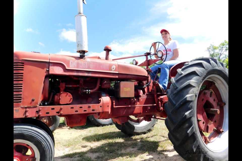 First time entrant, Janette Ellens of McBian, Mich. drove a Farmall H originally owned by her father. Photo by Donna Schell