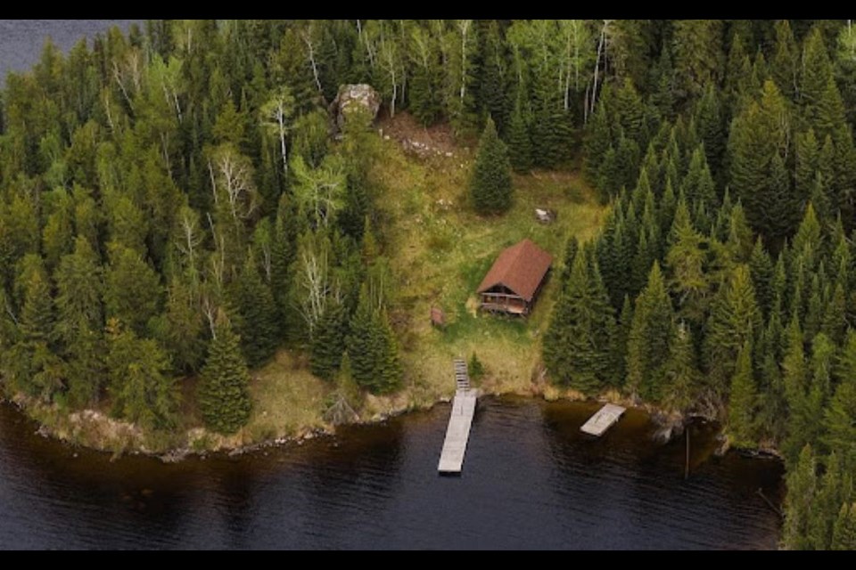 An aerial drone shot of the West Red Lake Mining Museum with the glacial erratic in the upper right corner.