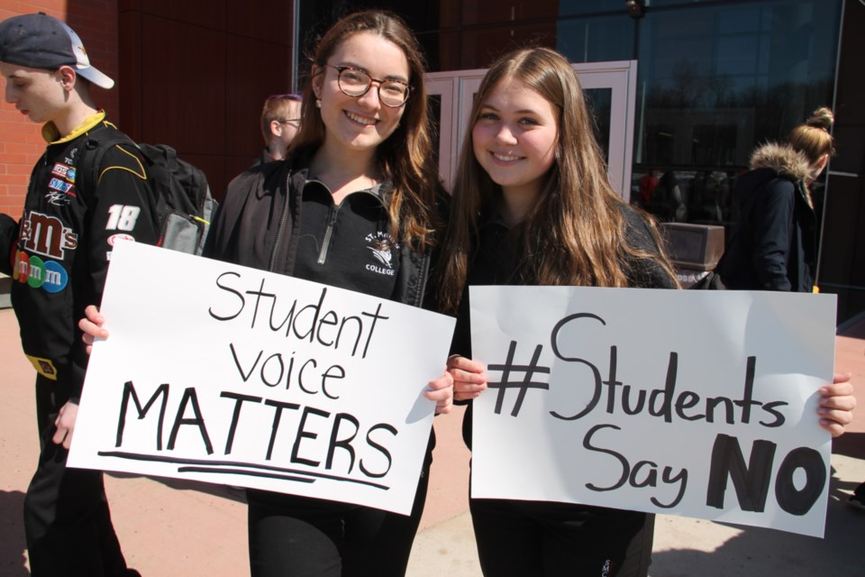 Eila Wigmore and Megan Morgenstern, St. Mary’s College Grade 11 students, took part in a mass student walkout at approximately 800 schools across Ontario, protesting Premier Doug Ford’s changes to the education system, April 4, 2019. Darren Taylor/SooToday