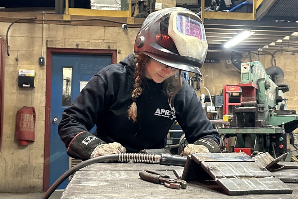 Hailly Poole checking a weld