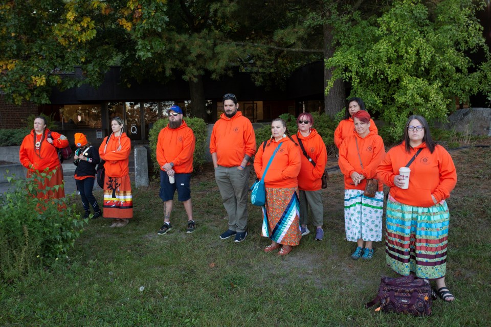 Dozens of people attended Monday's flag raising at Algoma University to mark Orange Shirt Day, otherwise known as Truth and Reconciliation Day.