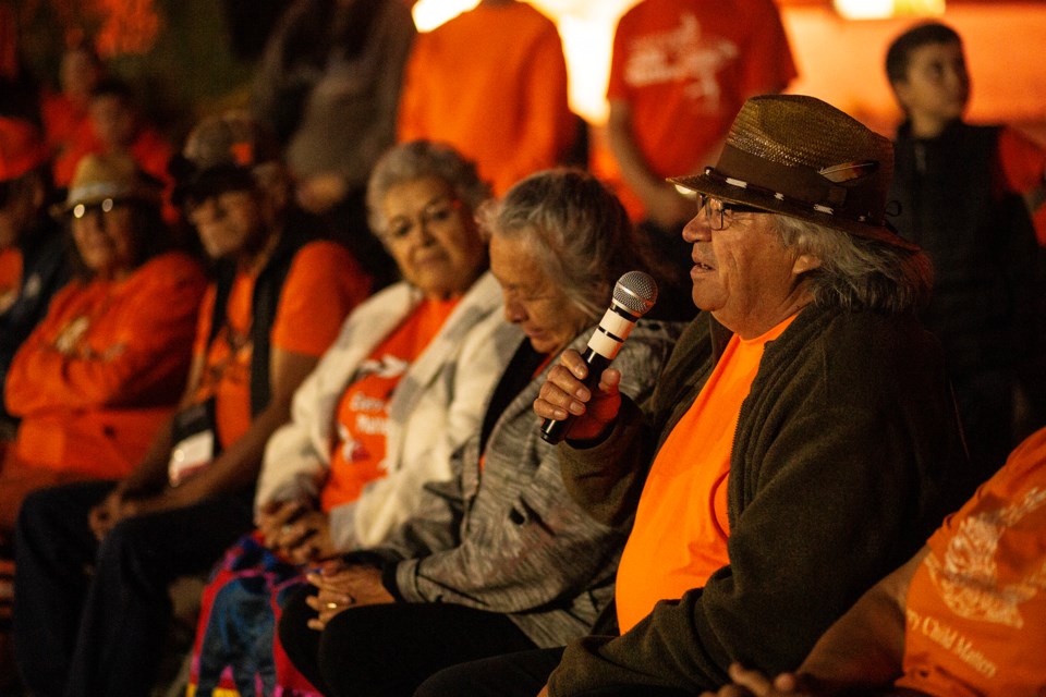 Residential school survivor George Diamond speaks during a candlelight vigil marking Orange Shirt Day on Monday evening at Algoma University. Diamond said the three residential schools he attended tried to take his language away, but were not successful. He said his 12 grandchildren all speak Cree.