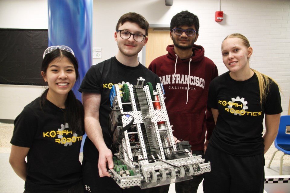 Korah Collegiate students Samantha Cho, Lars Fransen-Molino, Yaksha Contractor and Aili Luonaranta with their robot called ‘The Toaster Oven’ at the annual high school VEX Robotics competition, Dec. 14, 2024.