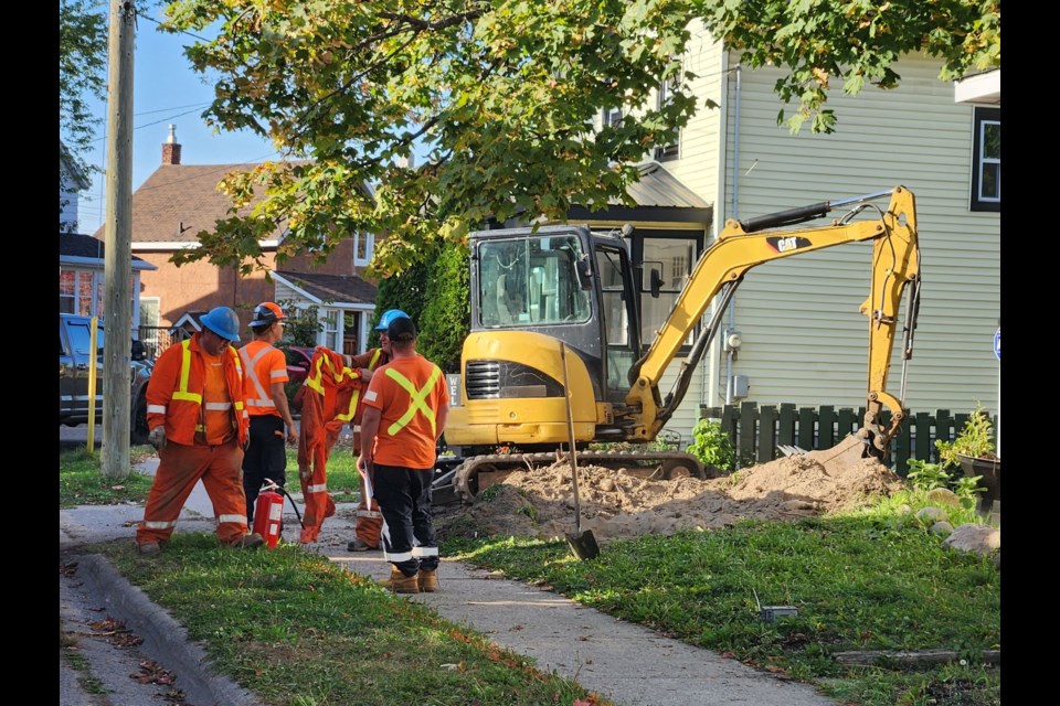 It appears an excavator digging in a front yard came into contact with the gas line