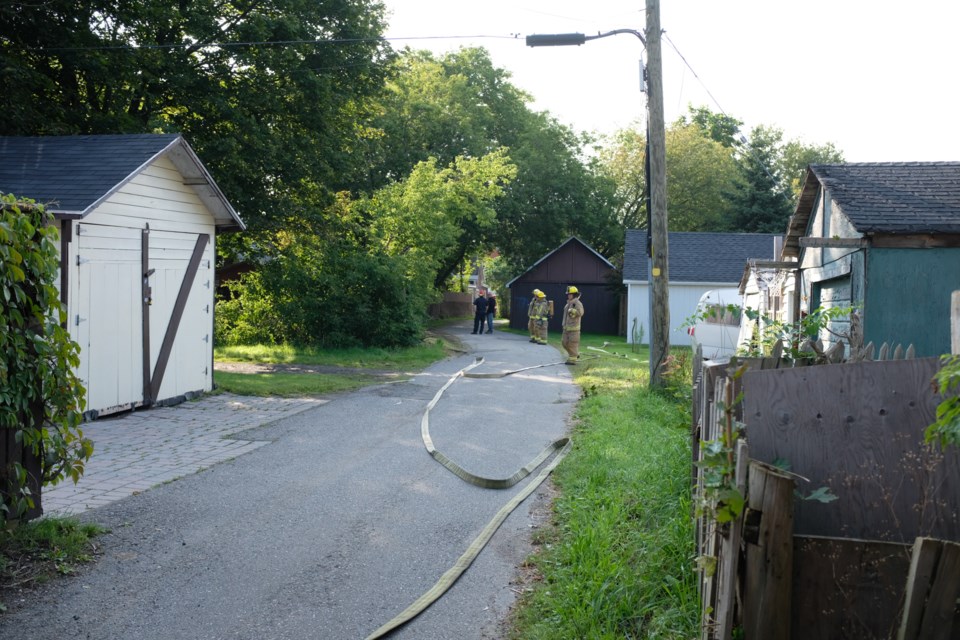 Sault Ste. Marie Fire Services are blocking off the alleyway between east-west running Wellington Street and Albert Street and north-south running Abbott Street and Tancred Street. Jeff Klassen/SooToday

