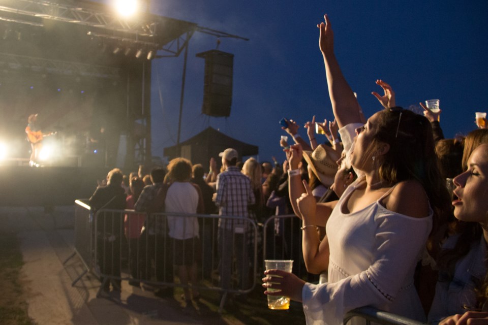 Ecstatic fans cheered and sang while Dean Brody played in front of thousands at The Yard on Friday evening. Photo by Jeff Klassen