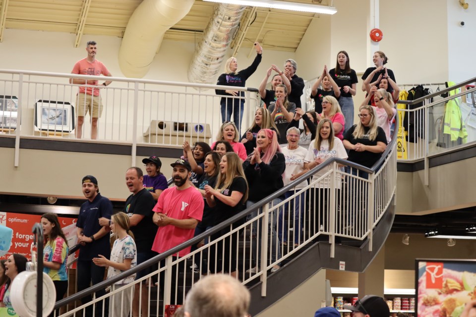 Former and current members of Soo Sings for Kids surprised grocery shoppers at Rome's on Saturday with a flash mob. 