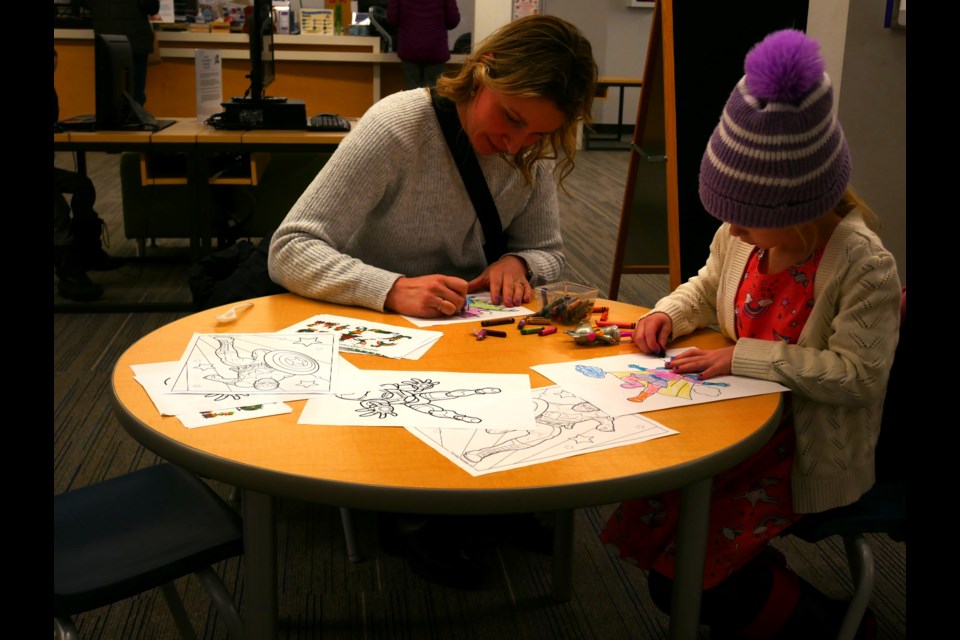 Angela Young and her daughter Leah were at the library on Tuesday