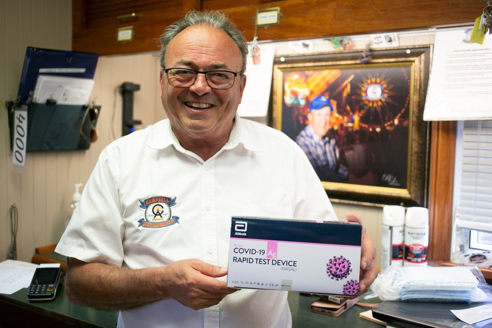 Campbell Amusements manager Stewart Bell holds up rapid testing kits, which the company uses to regularly test employees for COVID-19. It's just one of a number of safety protocols the company uses to operate the midway in the time of COVID-19. Kenneth Armstrong/SooToday